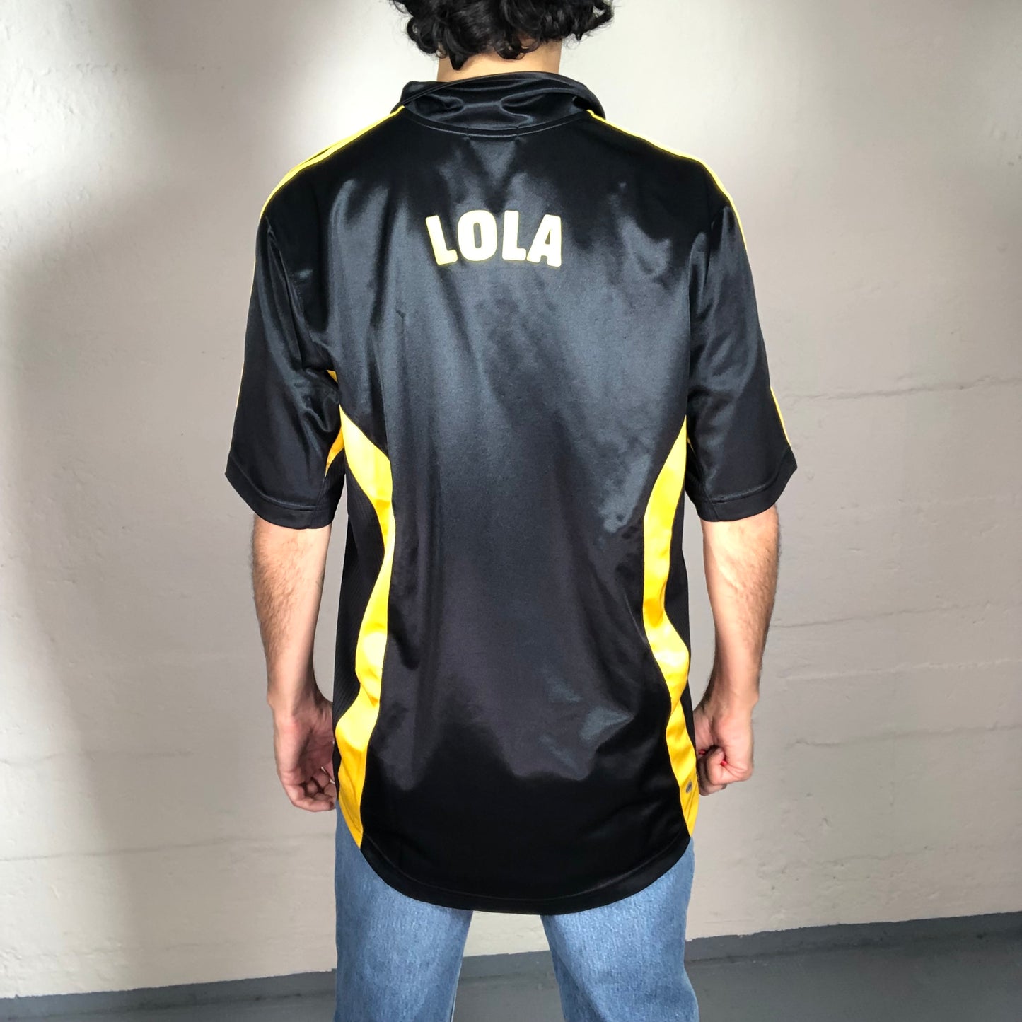 Vintage 90’s Sporty Football Style Black Sheer Archive Adidas T-Shirt with Yellow Stripes and Back Lola Print (M)